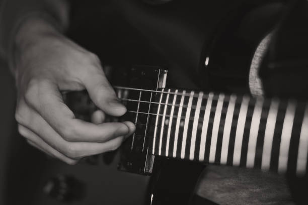 istock A guy playing an electric guitar. 2180790105