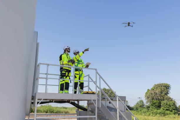 istock Engineers use drone to survey and inspect large wind turbine 2180791551