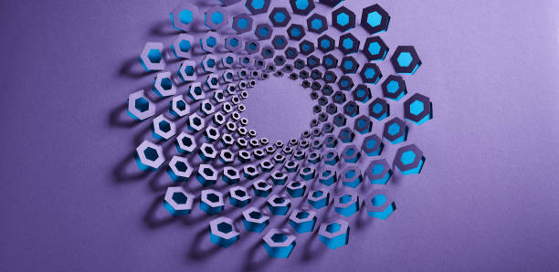 istock Hypnotic spiral paper art with hexagonal cutouts exposing a vibrant blue layer against a bold purple background. 2180791713
