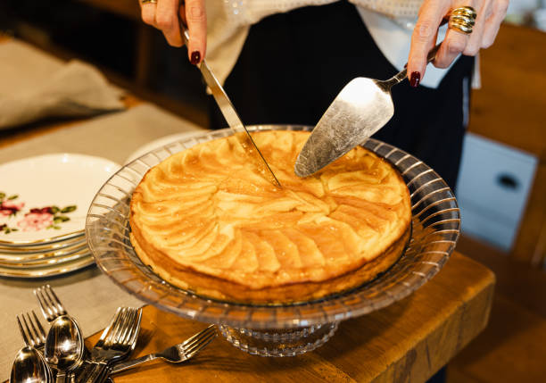 istock Cutting a homemade apple pie with a knife 2180792976