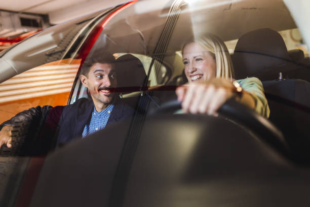 istock Happy couple drives around in the car. 2180793206