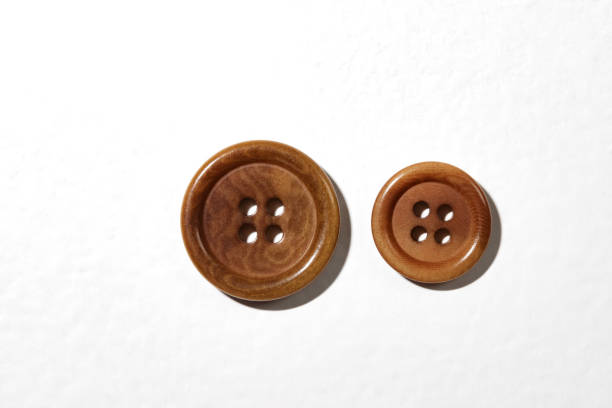 buttons for outerwear with four holes, isolated