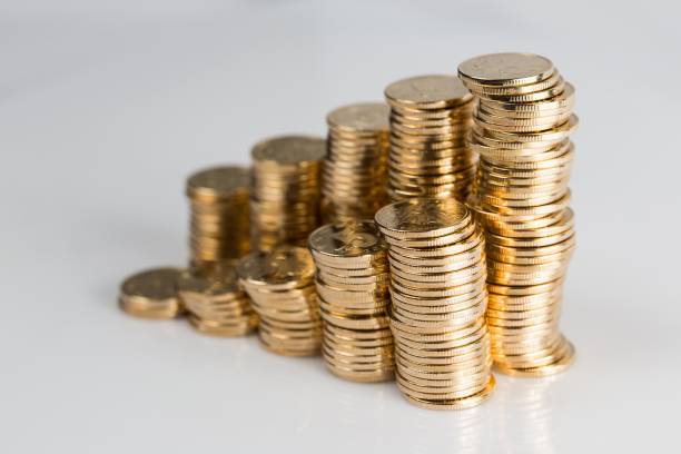 A stepladder made of stacked gold coins.