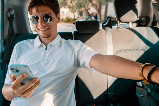 istock Passenger with smartphone on a road trip 2180804263