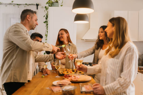 istock Friends gathering for dinner party 2180805225