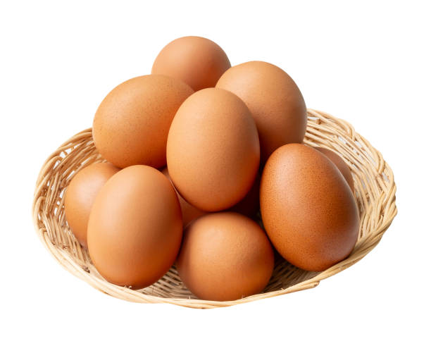istock Top view of group of fresh brown chicken eggs in stack in wicker basket isolated on white background with clipping path 2180805385