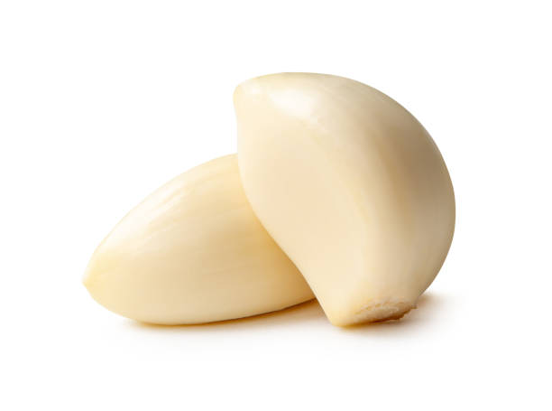 istock Side view of peeled garlic cloves in stack isolated on white background with clipping path 2180807021