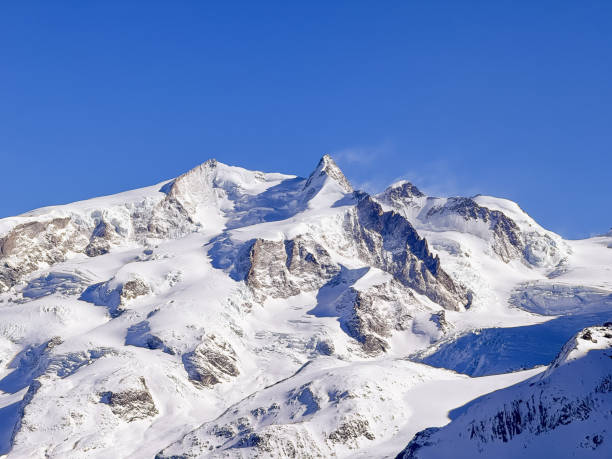 Switzerland highest peak Dufourspitze 4,634 m, Monte Rosa, above Zermatt town in Mattertal, Valais canton, Switzerland, in winter.