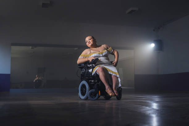 istock Female dancer with a disability during wheelchair ballroom dancing training 2180809065