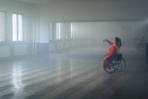 istock Woman with a disability, a para dancer practicing choreography at the dance studio 2180810978