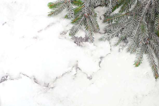 istock Background with fir branches on a light table,Christmas and New Year composition 2025,banner for a festive screen,template for design.Festive card,selective focus, 2180811935