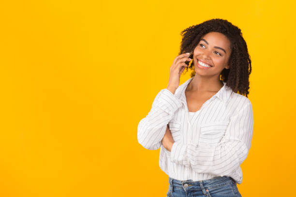 istock Happy afro model talking on mobile phone 2180815109
