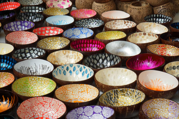 Colourful painted bowls on market stall