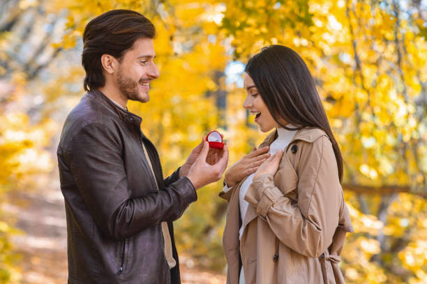 istock Romantic man in love making propose to his girlfriend 2180817717