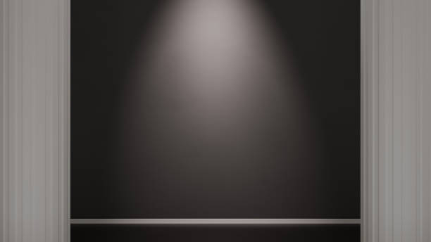 istock Dark wall lit by a spotlight, in a minimalist environment with classic columns 2180822697