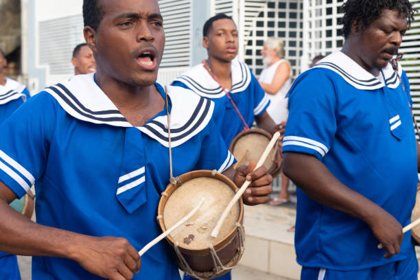 Saubara, Bahia, Brazil - August 03, 2024: Marujada cultural group dressed in typical clothes is seen dancing, singing and playing during a Chegancas meeting in the city of Saubara, Bahia.