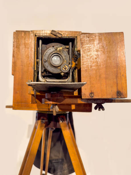 istock Antique bellows camera in wooden case in white background 2180830003
