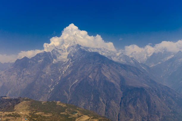 Dhaulagiri peak from khopra ridge with dramatic clouds in morning