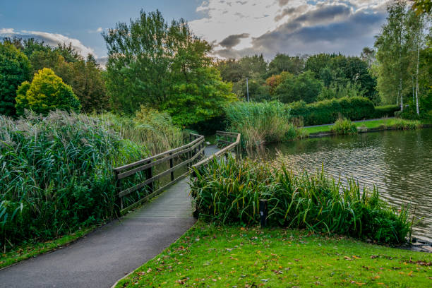 It is a nice park, a little bit large, good enough for biking and walking. There's a play area for kids and a nice little lake with ducks in it, If you want to sit down, there are benches and a large area of grass and trees to play.
