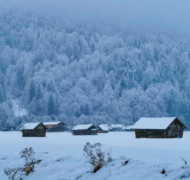 istock Wooden huts under layer of snow Garmisch Partenkirchen Germany 2180843502