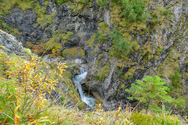 istock Flowing Mountain Creek in rocky Landscape 2180844363