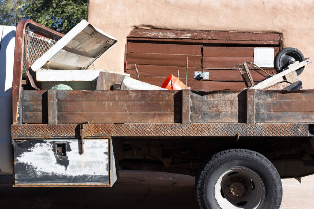 istock Dilapidated Truck with Construction Materials and Wheelbarrow, Cement 2180850550
