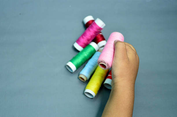 colourful of sewing thread isolated on grey background