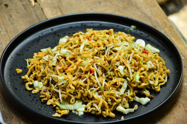 istock cook a delicious fried noodle with vegetables and spicy taste 2180855260