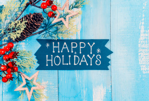 istock wooden board and text happy holidays on blue wood 2180855932