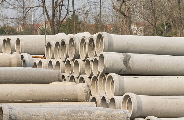 Concrete drainage pipes for industrial building construction.