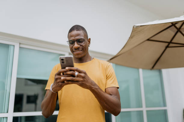 istock Man typing messages on smartphone at home 2180863128