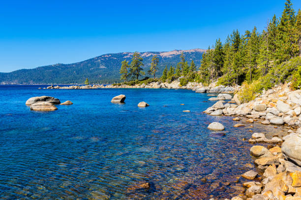 istock Turquoise Waters and Granite Boulders Along Hidden Beach 2180863456