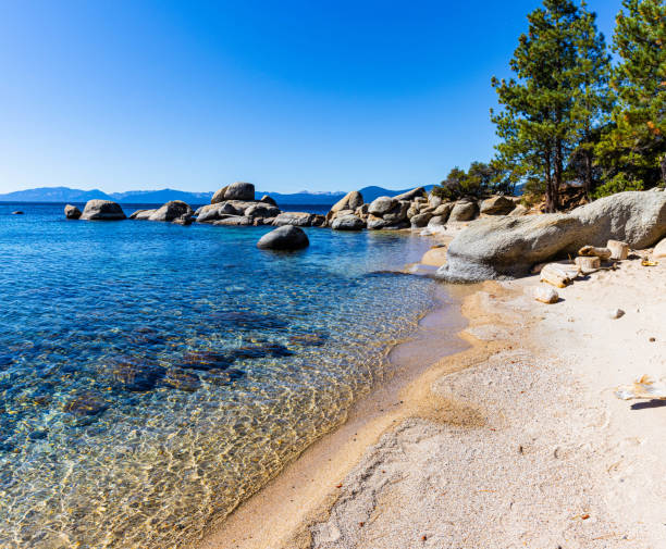 istock Turquoise Waters and Granite Boulders Along Hidden Beach 2180863635