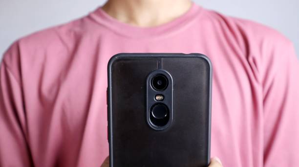 istock close-up of a man using a smartphone 2180864231