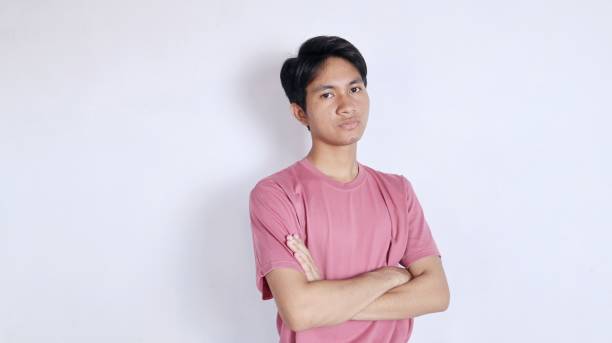 istock handsome asian man with crossed arms 2180867913