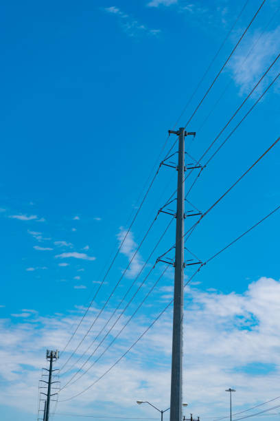 istock voltage transmission on electric tower. high voltage powerline. powerful substation. electricity provider. powering pylon utility. electricity power lines. Overhead pylon producing energy 2180868169