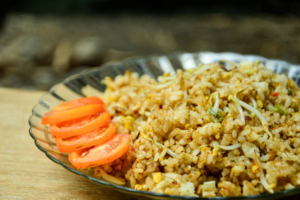 istock a plate full of delicious fried rice with fresh tomato 2180870401