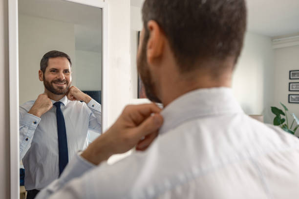 istock Gay man getting dressed  at the city apartment 2180872285