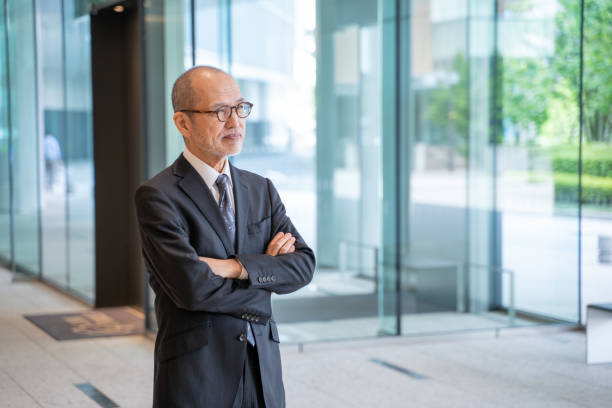 istock Senior male businessman folding his arms 2180881934