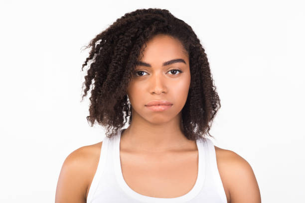 istock Headshot of serious black girl at studio 2180890675