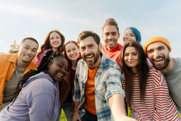 istock Group of diverse people taking a selfie in the park 2180892605