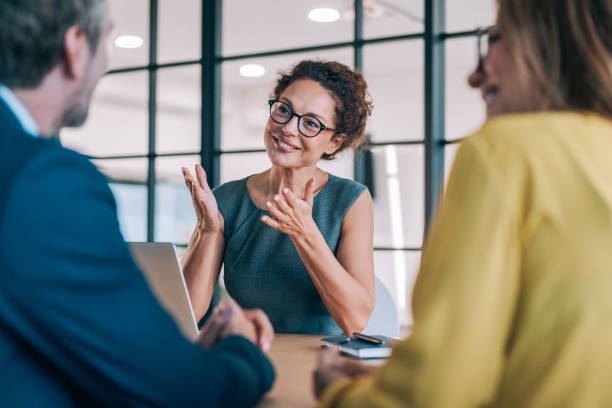 istock Group of business persons talking in the office. 2180893162