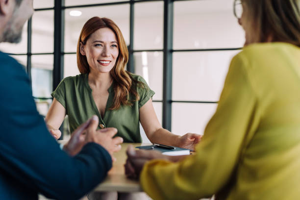 istock Group of business persons talking in the office. 2180893164