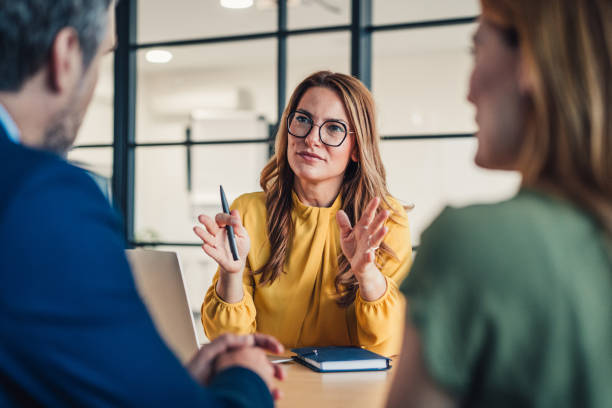 istock Group of business persons talking in the office. 2180893170