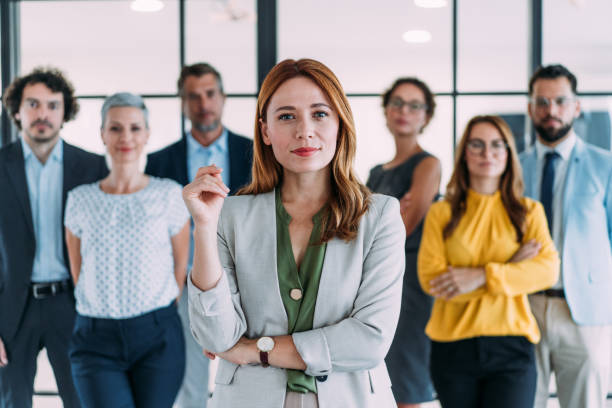 istock Confident businesswoman and her team. 2180893195