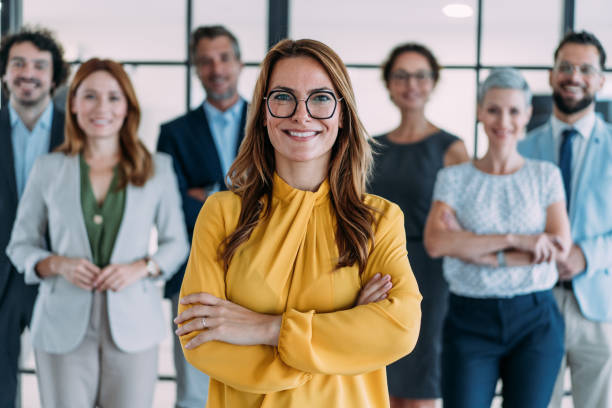 istock Confident businesswoman and her team. 2180893197