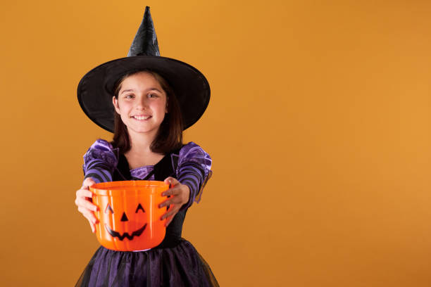 istock Holding out bucket for trick or treating 2180893376