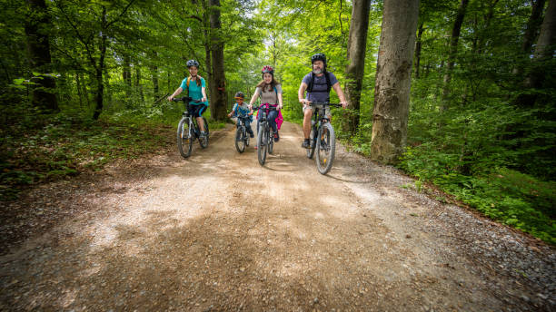 istock Caucasian Family Cycling in Forest 2180896754