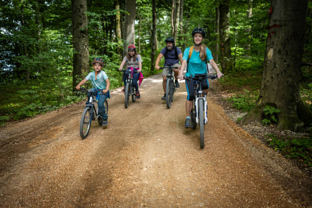 istock Caucasian Family Cycling in Forest 2180896764