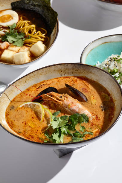 istock Vibrant Tom Yum Soup with Seafood in High-Contrast Lighting 2180903767